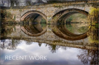 Photo of stone bridge in Knaresborough with still river water.