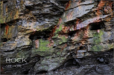 Coloured and shaped surface of a rock face